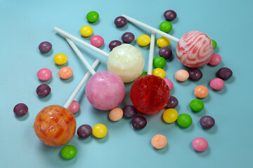 Fototapeta na wymiar Lollipops Colorful chocolate drops