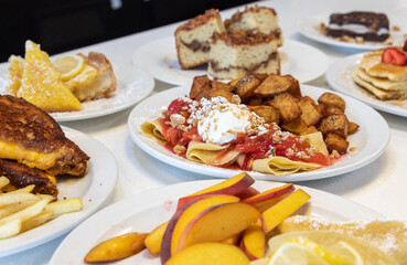 Brunch Spread with Crepes, Fresh Fruit, Potatoes and Pastries