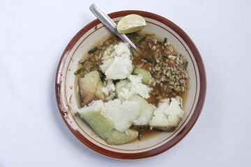 Lontong Kupang is a typical Indonesian meal based on sea shells and rice. food with sweet and spicy gravy