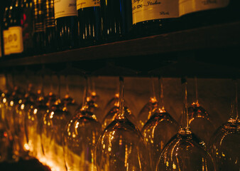 Wine Glasses Hanging in Cellar