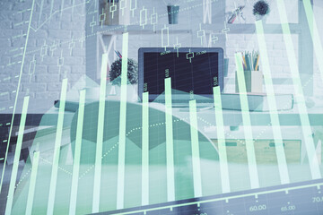 Double exposure of financial graph drawing and office interior background. Concept of stock market.