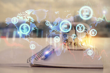 Double exposure of financial graph drawings and desk with open notebook background. Concept of forex market