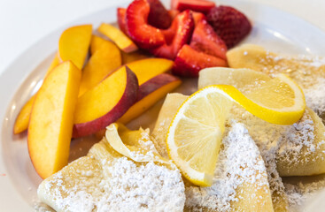 Crepes with Strawberries, Lemon, and Peach Slices 
