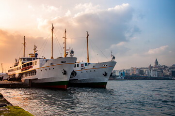 Fototapeta na wymiar Sunset and classic passenger ferries in Istanbul