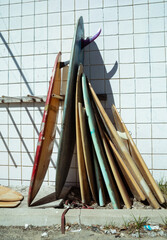 A rack of old surfboards