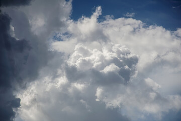 Naklejka na ściany i meble Dramatic clouds with blue sky background.
