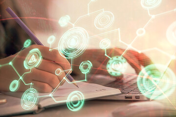 Double exposure of woman hands typing on computer and social network theme hologram drawing. People media concept.