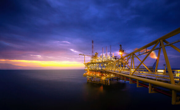 Industry of oil offshore jack up rig at gulf in the time after sunset.