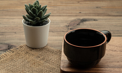 a cup on wood table background, hot tea
