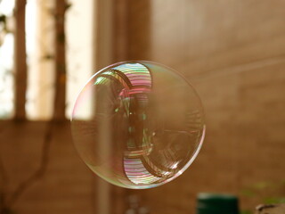 Child blowing a soap bubble