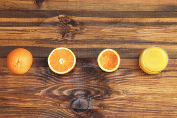 Fresh juicy oranges from above on wood table. Empty ready for your orange juice, fruit product display or montage.