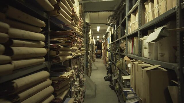 open shelf warehouse with files storaged at a bank building , smooth movement of camera towards the warehouse , organize storage unit