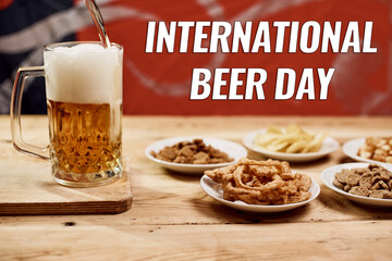 A glass of beer and different snacks on the table. Celebrating international beer day or Octoberfest. Drinking beer after a hard working day or week
