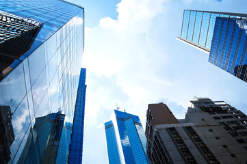 Fototapeta na wymiar Hong Kong City Skyscappers (Skyline) under Cloud and Blue Sky.