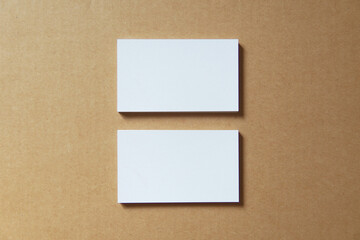 Fototapeta premium Business card on colored background. Blank name card for company logo, Branding Mock-up. Flat lay. Copy space for text 