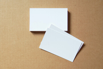 Business card on colored background. Blank name card for company logo,  Branding Mock-up. Flat lay. Copy space for text       