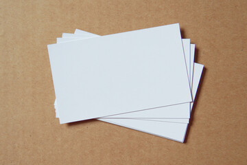 Business card on colored background. Blank name card for company logo,  Branding Mock-up. Flat lay. Copy space for text       