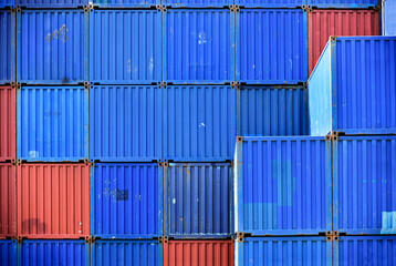 Fototapeta premium Stacked cargo at maritime transport terminal: shipping industry