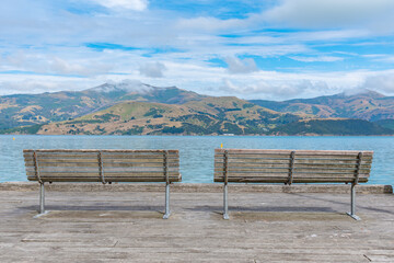 Wooden bench overlooking Banks peninsula at Akaroa, New Zealand