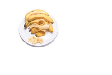 Bunch of bananas on a white background on a plate