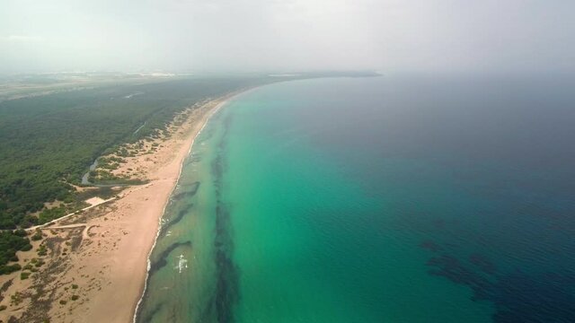 Motionlapse of Kalogria beach during cloudy day, drone jib shot