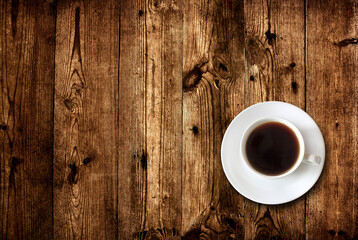 cup of coffee on wooden background