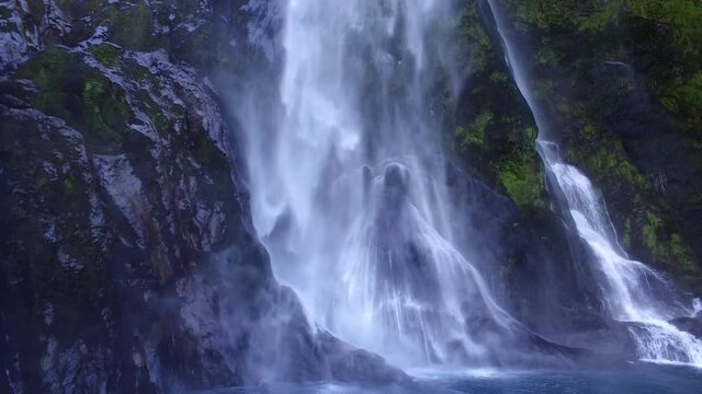 Scenic waterfall at Milford Sound, New Zealand