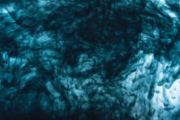 Black ink color dripping in water
