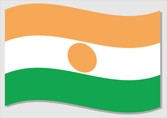 Waving flag of Niger vector graphic. Waving Nigerien flag illustration. Niger country flag wavin in the wind is a symbol of freedom and independence.