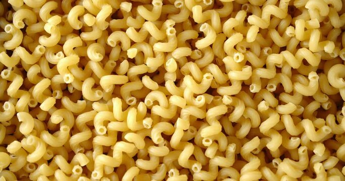 Cavatappi pasta dry slowly rotates.