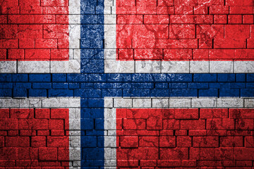 National flag of Norway on brick  wall background.The concept of national pride and symbol of the country. Flag  banner on  stone texture background.