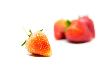 Fresh ripe strawberries on a white background.