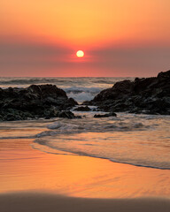 sunrise through the rocks