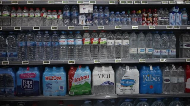 BARCELONA, SPAIN - FEBRUARY 17, 2020: Bottles with mineral water and refreshing drinks in supermarket