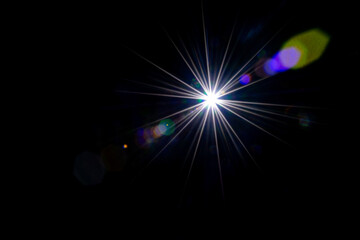 Flare color glow. Sun flash ray lens effect on black. Star spot light or sunlight glow. Abstract bokeh lights and optical leaking reflection