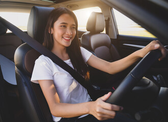 Asian woman driving  a car