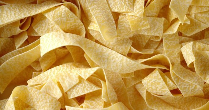 Pasta pappardelle dry slowly rotates.