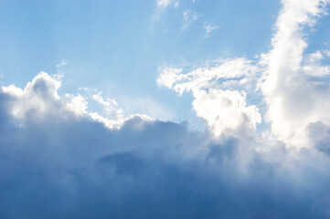 Naklejka na ściany i meble Rainy clouds on blue sky. Beautiful natural background.