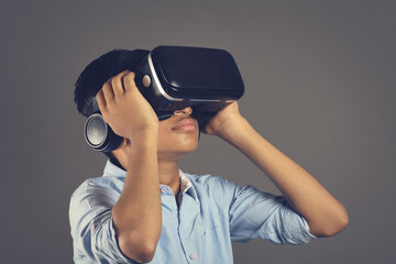 Portrait of Indian young boy wearing Virtual Reality Glasses	
