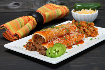 Mexican beef enchiladas with rice.