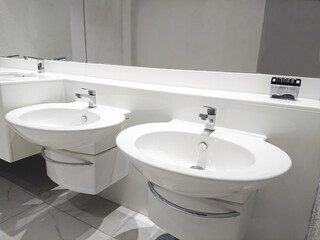 close up on a faucet of a sink in modern bathroom