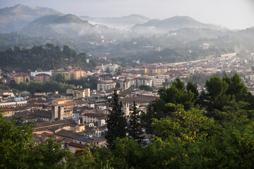 Fototapeta na wymiar Panoramic view on Ascoli Piceno (Marche, Italy) in early morning with mist in the hills
