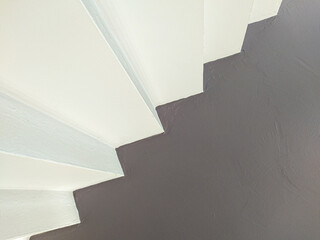 concrete stairs leading to red exit door