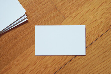 Business card on colored background. Blank name card for company logo,  Branding Mock-up. Flat lay. Copy space for text       