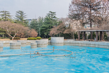 Concrete cylinders inside water fountain