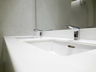 close up on a faucet of a sink in modern bathroom