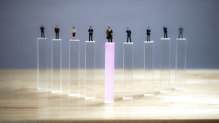conceptual businessman figures with clear blocks,