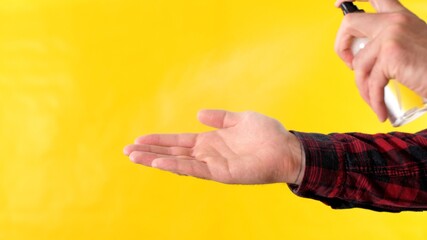 Spray for hygiene. Man clean her hands with antibacterial liquid spray. Man using alcohol gel sanitizer to clean hands and skin against virus, germs, bacteria for health care. Coronavirus or covid-19