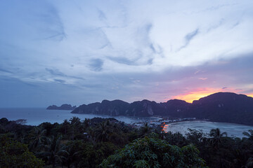 Wonderful sunset on Phi Phi Don island view point. Beautiful landscape with tropical sea lagoon.