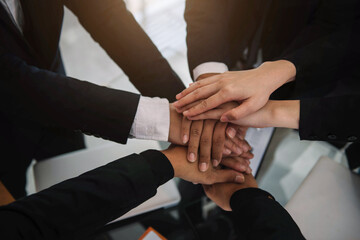 Business teamwork and women shake hands confidently at an office meeting.